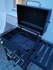 a black grill sitting on top of a table at Tifani Apartman in Keszthely