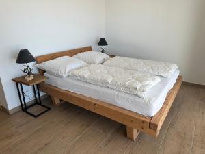 Postel nebo postele na pokoji v ubytování Reimers Chalets Hochrindl 2A