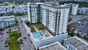 an overhead view of a large building in a city at Kuching Tabuan Tranquility Apartment TT3 Soho C11 in Kuching