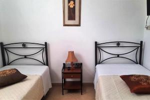 Postel nebo postele na pokoji v ubytování CORFU MAGDAS HOLIDAY
