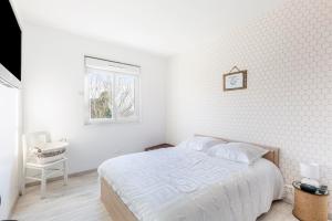 Ένα ή περισσότερα κρεβάτια σε δωμάτιο στο Le Gîte des 5 étangs