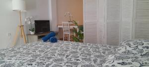 Łóżko lub łóżka w pokoju w obiekcie Loft 105