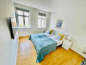Postel nebo postele na pokoji v ubytování aday - Reberbansgade Central Apartment