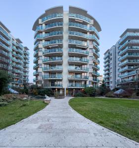 a large apartment building with a park in front of it at Duna terrace in Budapest