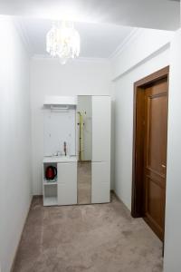 a white room with a mirror and a door at Chalet jolie Luxury Vila Sinaia in Sinaia