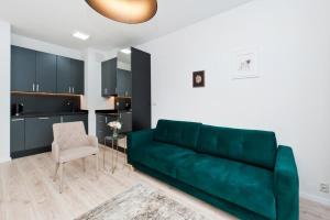 Kuchyňa alebo kuchynka v ubytovaní Apartamenty Rakowicka WAWELOFTS