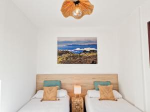 Posteľ alebo postele v izbe v ubytovaní MEDANO4YOU The Ocean Terrace Penthouse
