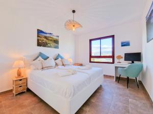 Posteľ alebo postele v izbe v ubytovaní MEDANO4YOU The Ocean Terrace Penthouse