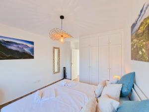 Posteľ alebo postele v izbe v ubytovaní MEDANO4YOU The Ocean Terrace Penthouse