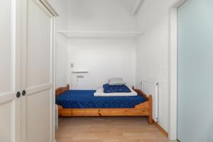 Postel nebo postele na pokoji v ubytování Hello Zeeland - Vakantiehuis Duinroos 133