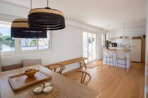 a kitchen and dining room with a table and chairs at Le Petit Palais in Cannes