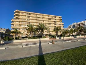 a shadow of a person standing in front of a building at Mar Play in Sant Antoni de Calonge