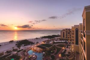 an aerial view of the beach and the ocean at sunset at The Ritz-Carlton, Aruba in Palm-Eagle Beach