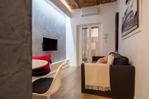 a living room with a couch and a table at Urbanflat Repubblica Square in Rome