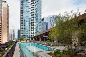 a swimming pool in a city with tall buildings at JW Marriott Austin in Austin