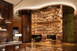 a restaurant with a wall of wine glasses at JW Marriott Hotel Lima in Lima