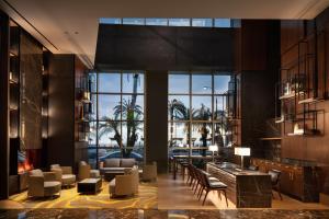 a lobby with a view of a pool at JW Marriott Hotel Lima in Lima