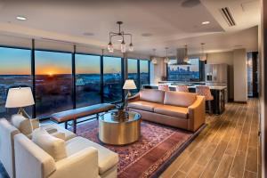 a living room with a couch and a table at SpringHill Suites by Marriott Fort Worth Historic Stockyards in Fort Worth