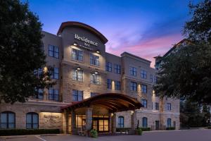 a rendering of the restoration hotel at dusk at Residence Inn Fort Worth Cultural District in Fort Worth