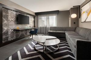 a living room with a couch and a table at The Clancy, Autograph Collection in San Francisco