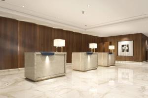 a lobby with three podiums in a building at Athens Marriott Hotel in Athens