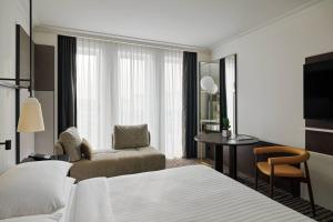 Un ou plusieurs lits dans un hébergement de l'établissement Berlin Marriott Hotel