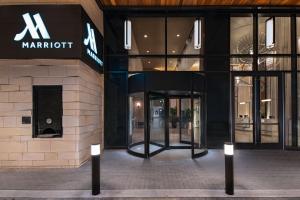 a store front of a marriot building with a revolving door at Austin Marriott Downtown in Austin