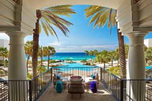 a view of the beach from the balcony of a resort at Curaçao Marriott Beach Resort in Willemstad