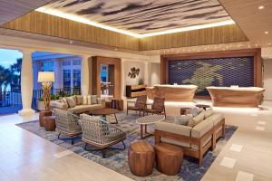 a lobby with couches and chairs and a living room at Curaçao Marriott Beach Resort in Willemstad