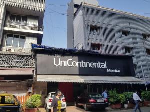 a sign for aun centripetal museum on a building at Hotel Unicontinental in Mumbai