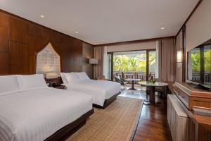 Ein Bett oder Betten in einem Zimmer der Unterkunft Phuket Marriott Resort and Spa, Nai Yang Beach