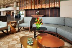 a lobby with a couch and tables and chairs at The Westin Hapuna Beach Resort in Hapuna Beach