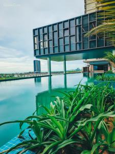 a view of a body of water with a building at BotakCuteHomestay@BaliResidence in Melaka +21 photos