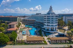 a large building with a pool in front of it at Seaden Quality Resort & Spa Ultra All Inclusive in Side