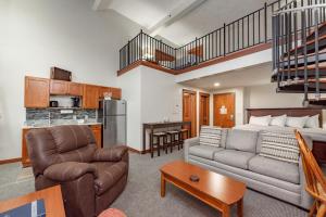 a living room with a couch and a bed at A306 Studio & Loft Standard View in Oakland