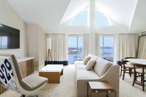 a living room with a couch and a table at Newport Marriott Hotel & Spa in Newport