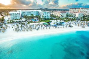 an aerial view of the beach at a resort at Aruba Marriott Resort & Stellaris Casino in Palm-Eagle Beach