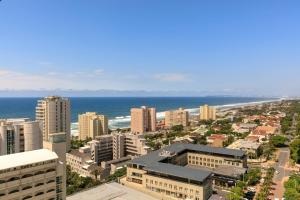 an aerial view of a city with the ocean at Protea Hotel by Marriott Durban Umhlanga in Durban