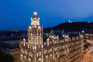 a view of a building at night at Matild Palace, a Luxury Collection Hotel in Budapest