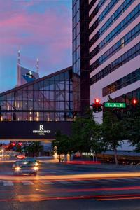 a building with a traffic light and a street with cars at Renaissance Nashville Hotel in Nashville