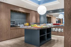 a kitchen with a counter with fruit on it at B&B HOTEL Vitoria General Álava in Vitoria-Gasteiz