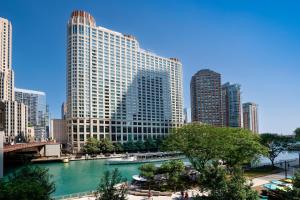 a view of a river in a city with tall buildings at Sheraton Grand Chicago Riverwalk in Chicago