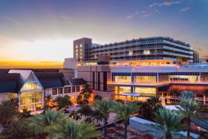 a rendering of a building with palm trees in front of it at JW Marriott Marco Island Beach Resort in Marco Island