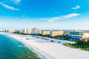 an aerial view of the beach in front of a city at JW Marriott Marco Island Beach Resort in Marco Island