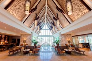 a lobby with chairs and tables in a building at JW Marriott Marco Island Beach Resort in Marco Island