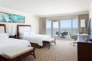 a hotel room with two beds and a balcony at JW Marriott Marco Island Beach Resort in Marco Island