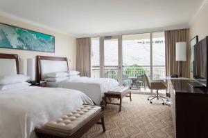 a hotel room with two beds and a balcony at JW Marriott Marco Island Beach Resort in Marco Island