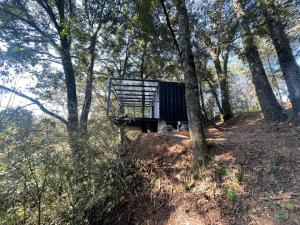 a cabin on top of a hill in the woods at ZACATLAN CONTENEDORES in Tomatlán