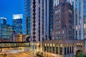 a view of a city at night with tall buildings at Hotel Ivy, a Luxury Collection Hotel, Minneapolis in Minneapolis