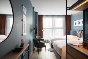 Ein Bett oder Betten in einem Zimmer der Unterkunft RYSE, Autograph Collection by Marriott